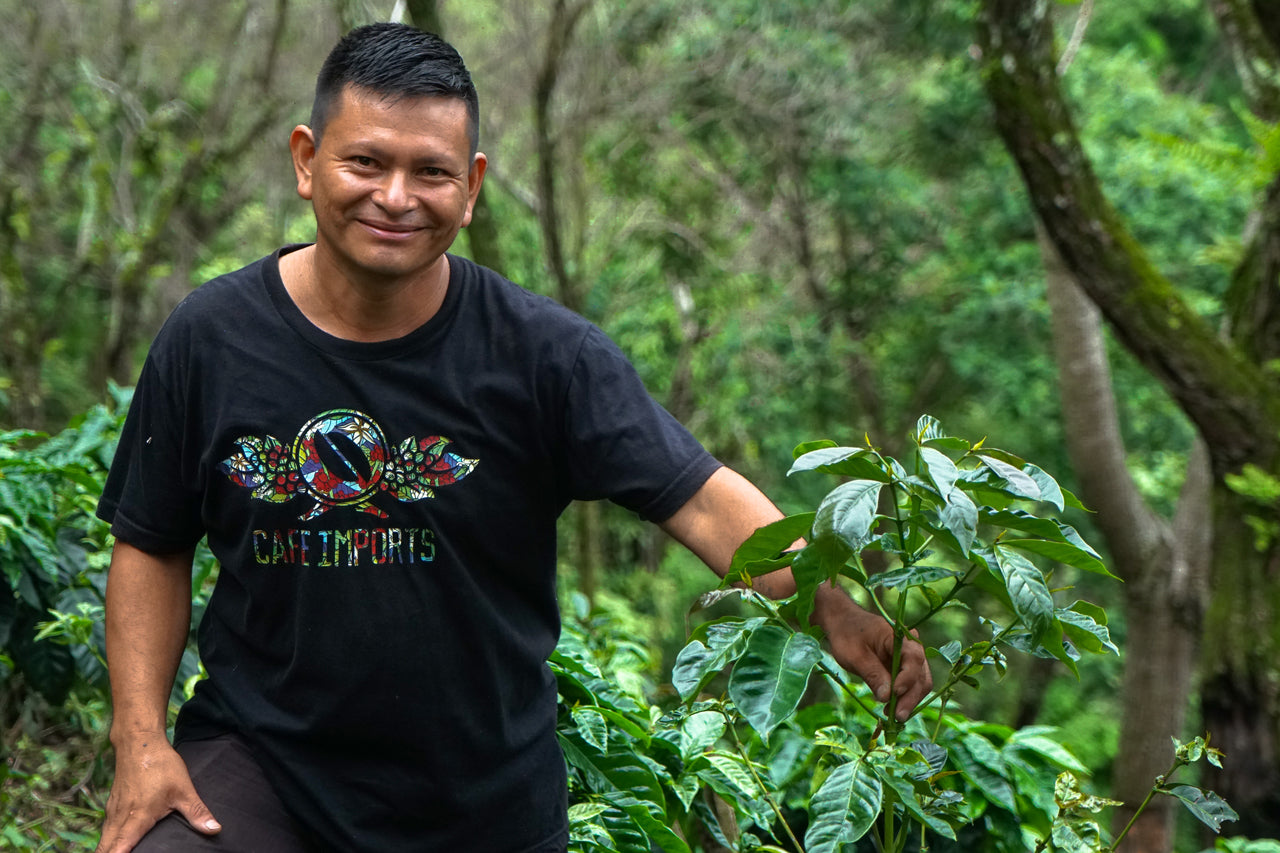Cafe imports coffee farm for Redhawk Coffee Roasters, happy farmers showing their produce.